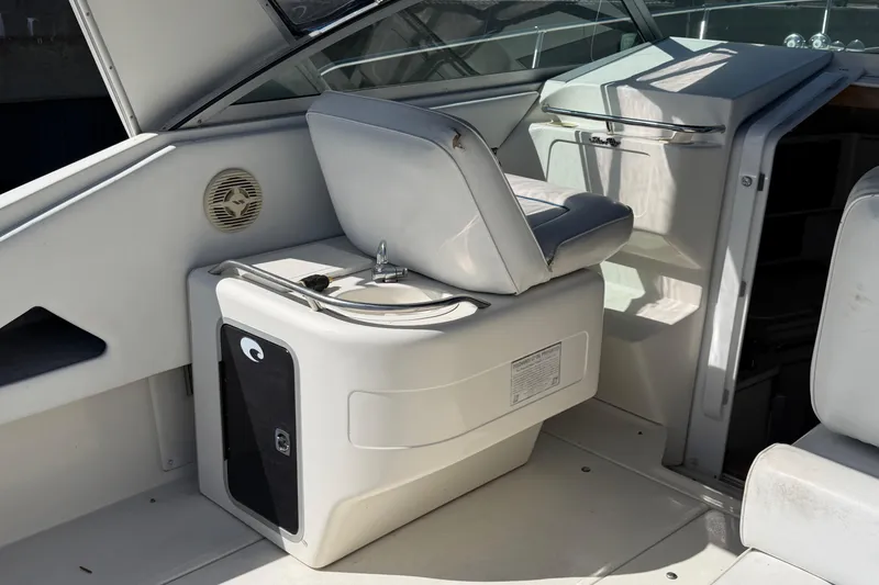 Slide: The Image of Cozy cabin interior of 1994 Sea Ray 370 Express Cruiser with plush bedding. - 22