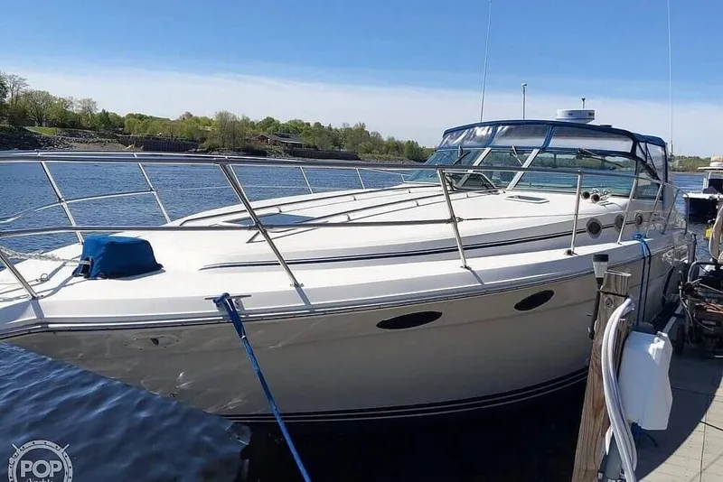 Slide: The Image of 1994 Sea Ray 370 Express Cruiser docked on a sunny day. - 30