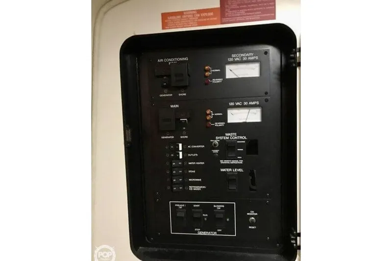 Slide: The Image of Electrical control panel on a 1994 Sea Ray 370 Express Cruiser boat. - 6