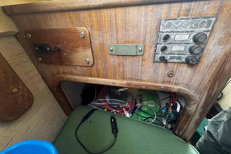 Slide: The Image of Interior of a 1976 custom wooden sloop showing control panel and wiring. - 23