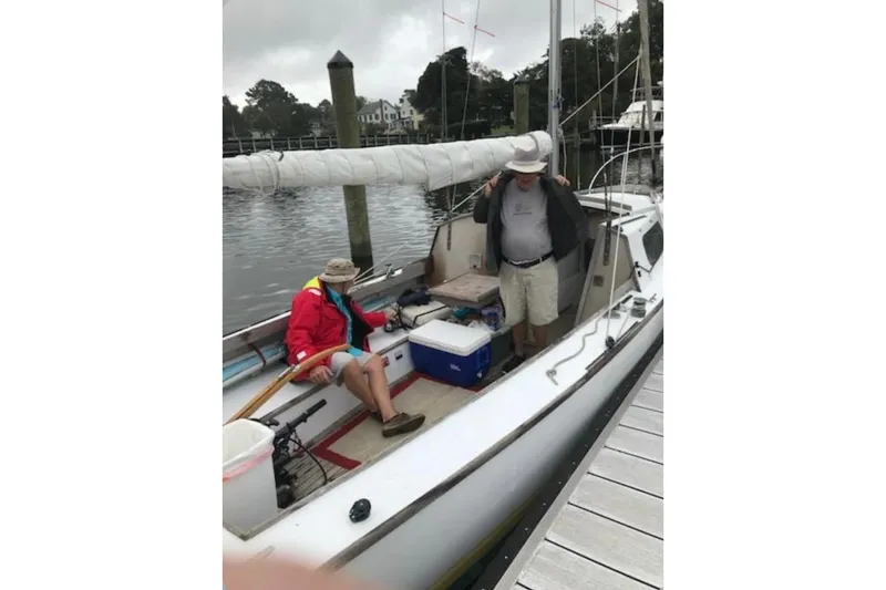 Slide: The Image of 1976 Custom Wooden Sloop for sale at McCotters Marina, on trailer in wooded area. - 4