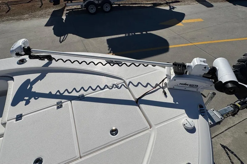 Slide: The Image of 2023 Robalo 266 Cayman boat with Minn Kota trolling motor on deck. - 16