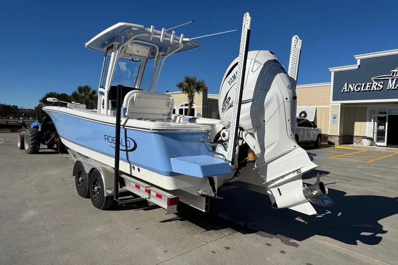 Slide: The Image of 2023 Robalo 266 Cayman boat with Yamaha engine at Angler's Marine dealership. - 2