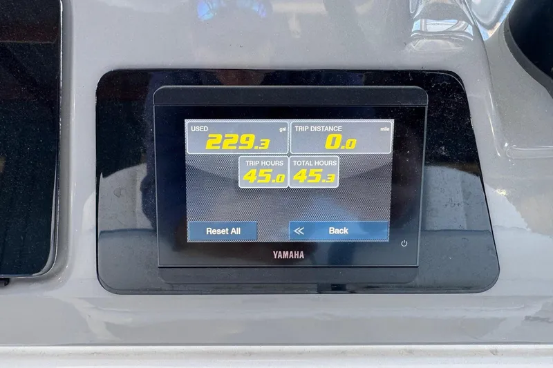 Slide: The Image of Yamaha display on 2023 Robalo 266 Cayman showing fuel usage and trip hours. - 8