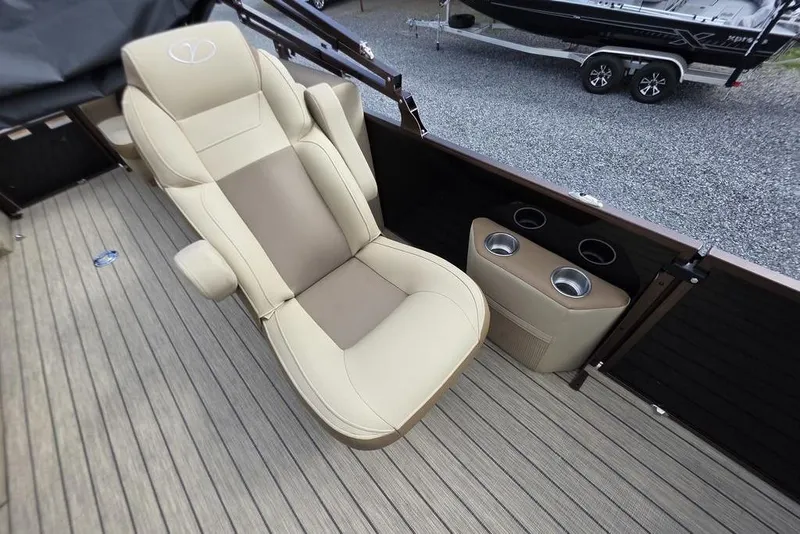 Slide: The Image of 2026 Veranda VR22RC Tri-Toon boat with reflective surface and clear sky background. - 15