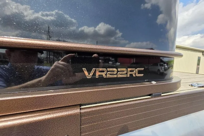 Slide: The Image of Luxurious seating and table setup on 2026 Veranda VR22RC Tri-Toon boat interior. - 2