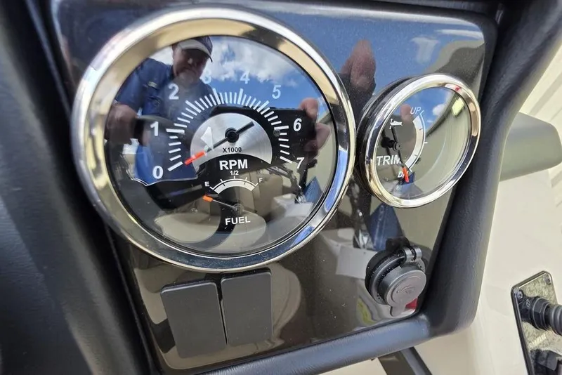 Slide: The Image of 2026 Veranda VR22RC Tri-Toon logo on sleek black surface under blue sky. - 24