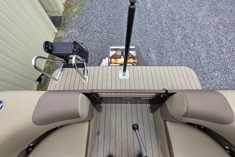 Slide: The Image of Trailer hitch of 2026 Veranda VR22RC Tri-Toon on gravel surface. - 31