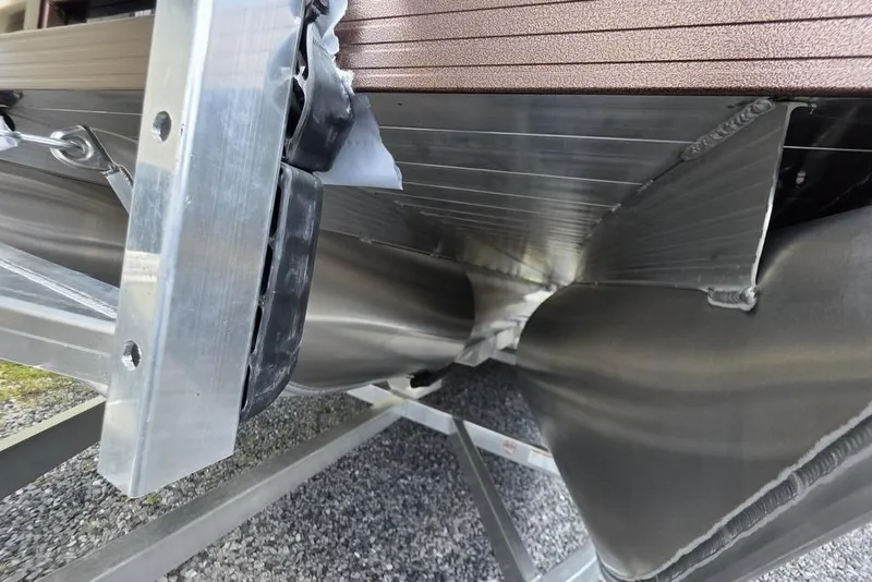 Slide: The Image of 2026 Veranda VR22RC Tri-Toon boat interior with beige captain's chair and steering console. - 4