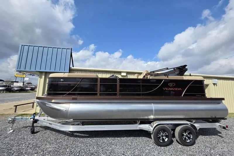 Slide: The Image of Luxurious seating on 2026 Veranda VR22RC Tri-Toon boat with cup holders and sleek design. - 5