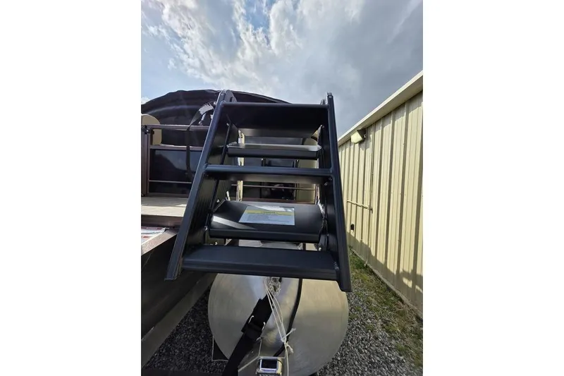 Slide: The Image of Control panel of 2026 Veranda VR22RC Tri-Toon with labeled switches and Kicker cover. - 7