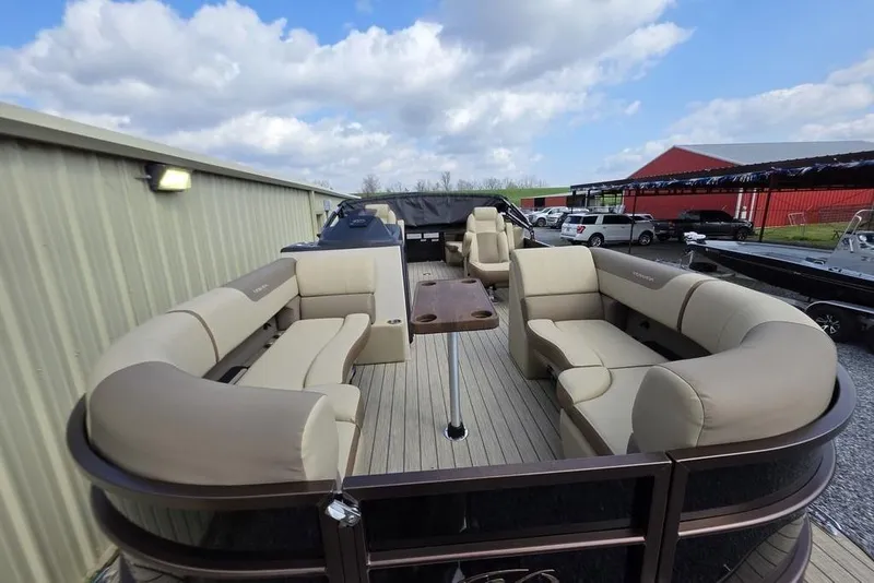 Slide: The Image of 2026 Veranda VR22RC Tri-Toon boat interior with beige cushioned seating. - 9