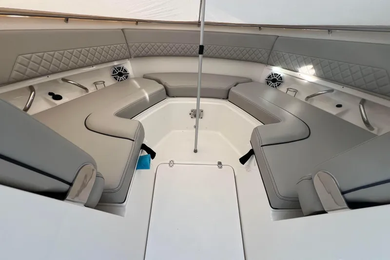 Slide: The Image of 2024 Pursuit DC 326 Dual Console boat interior with luxurious seating and modern design. - 12