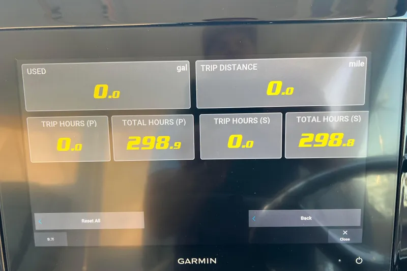 Slide: The Image of Garmin display on 2024 Pursuit DC 326 Dual Console showing trip and fuel data. - 16