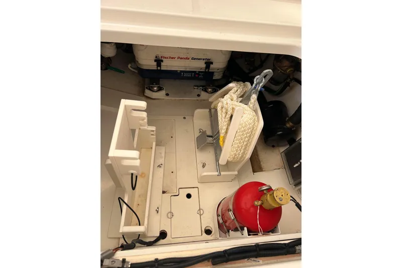 Slide: The Image of 2024 Pursuit DC 326 Dual Console boat interior with generator and safety equipment. - 17