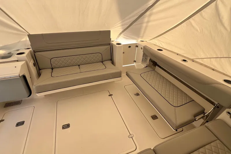 Slide: The Image of 2024 Pursuit DC 326 Dual Console interior with luxurious seating and elegant design. - 6