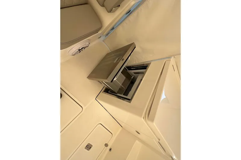 Slide: The Image of 2024 Pursuit DC 326 Dual Console interior with built-in stainless steel appliance. - 8