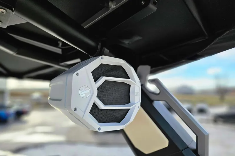 Slide: The Image of 2026 Tigé 24RZX boat speaker, mounted under a canopy, close-up view. - 14