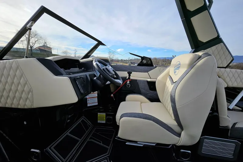 Slide: The Image of 2026 Tigé 24RZX boat interior with luxurious seating and modern dashboard design. - 16