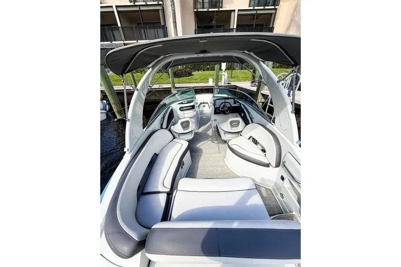 Slide: The Image of 2023 Crownline 270 XSS boat on water, featuring sleek design and spacious seating. - 1