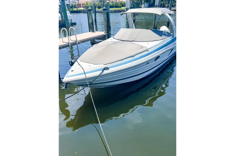 Slide: The Image of 2023 Crownline 270 XSS boat with Mercury outboard engine on water. - 5