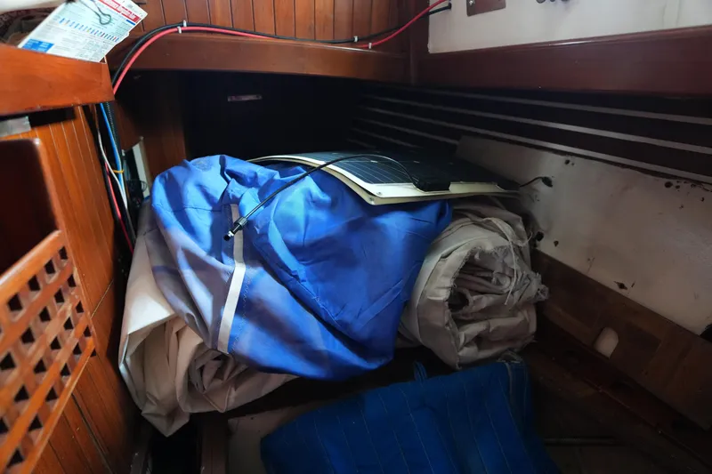 Slide: The Image of Storage area in 1983 Tayana 37 sailboat with sails and equipment. - 25