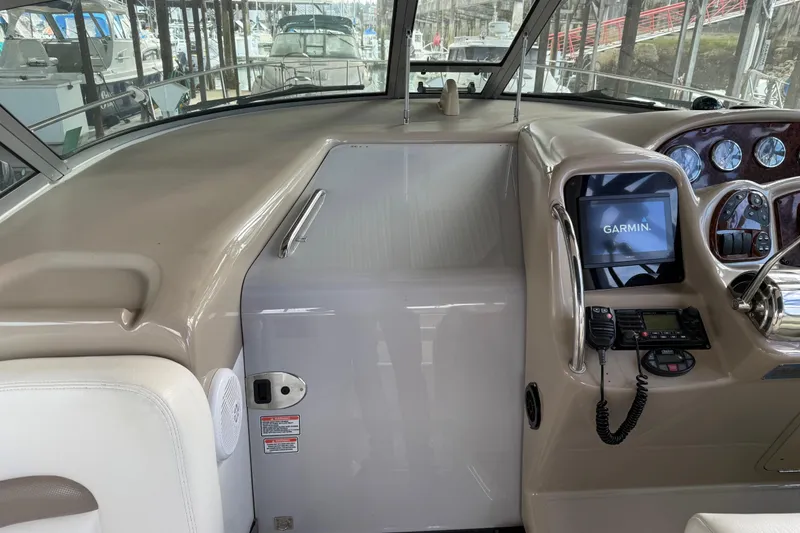 Slide: The Image of 2005 Sea Ray Sundancer 320 helm with Garmin navigation system and control panel. - 17