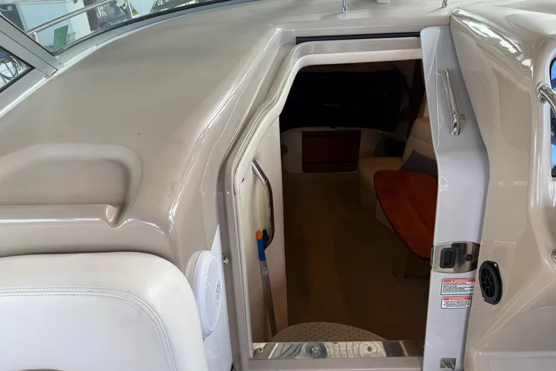 Slide: The Image of 2005 Sea Ray Sundancer 320 cabin entrance, featuring sleek interior design and comfortable seating. - 18
