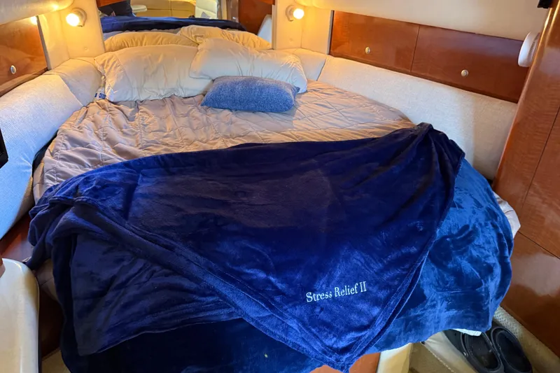 Slide: The Image of Cozy cabin bed in 2005 Sea Ray Sundancer 320 yacht with blue blanket. - 21