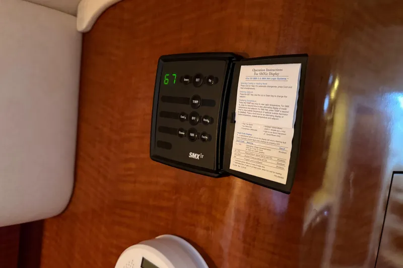 Slide: The Image of SMX II control panel on 2005 Sea Ray Sundancer 320 yacht interior. - 24