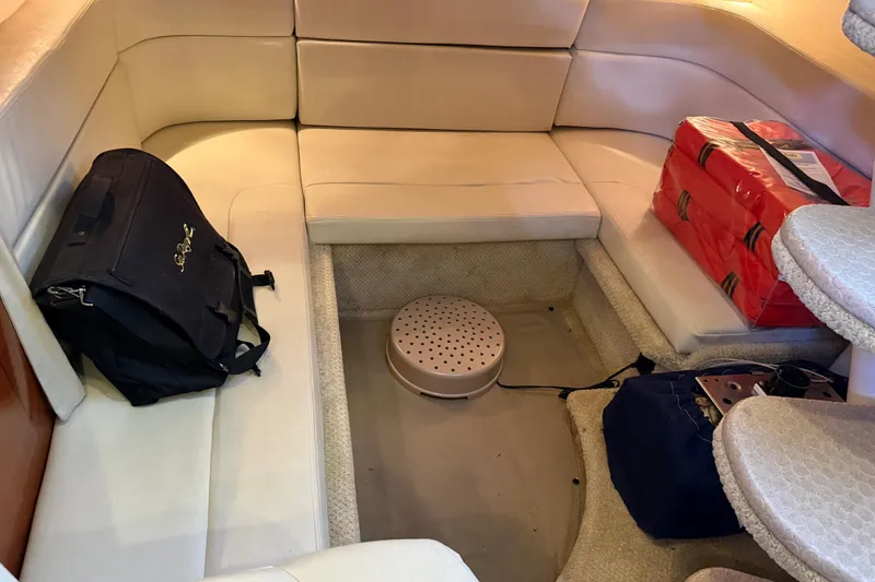 Slide: The Image of Interior of 2005 Sea Ray Sundancer 320 with seating, bags, and life jackets. - 32