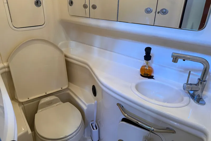 Slide: The Image of Bathroom interior of 2005 Sea Ray Sundancer 320 yacht, featuring sink and toilet. - 36