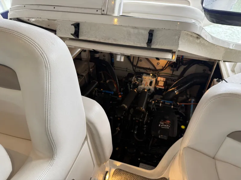 Slide: The Image of Engine compartment of 2005 Sea Ray 320 Sundancer with visible seating and mechanical components. - 37