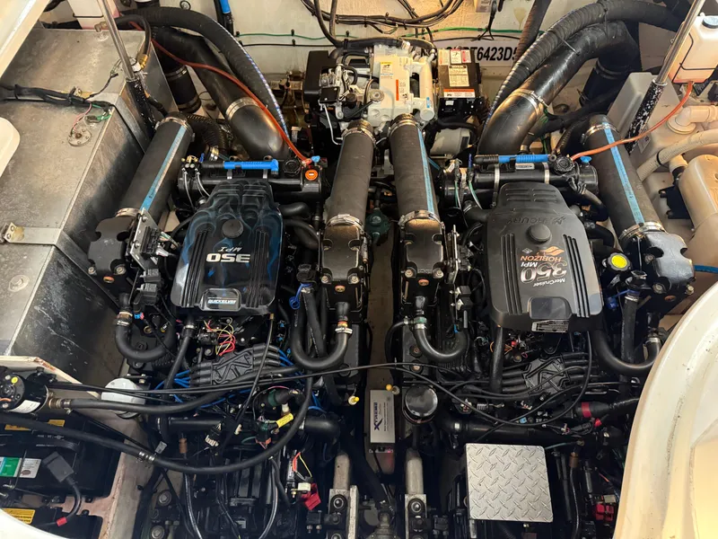 Slide: The Image of Engine compartment of a 2005 Sea Ray 320 Sundancer, featuring twin MerCruiser 350 engines. - 38