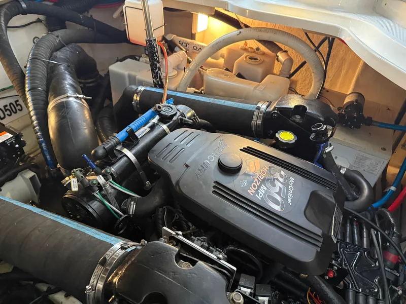 Slide: The Image of Engine compartment of a 2005 Sea Ray 320 Sundancer boat, showcasing detailed components. - 40
