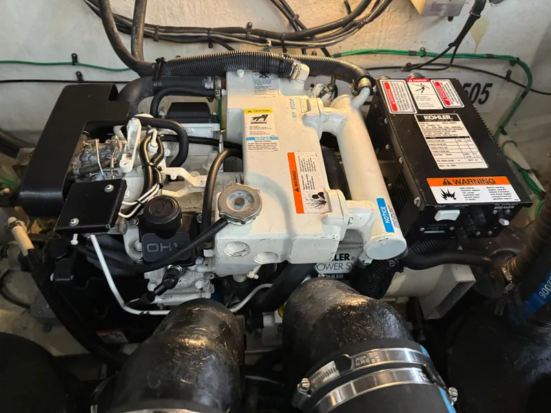 Slide: The Image of Engine compartment of a 2005 Sea Ray 320 Sundancer boat. - 41