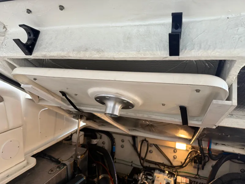 Slide: The Image of Engine compartment of a 2005 Sea Ray 320 Sundancer boat, showing mechanical components. - 45
