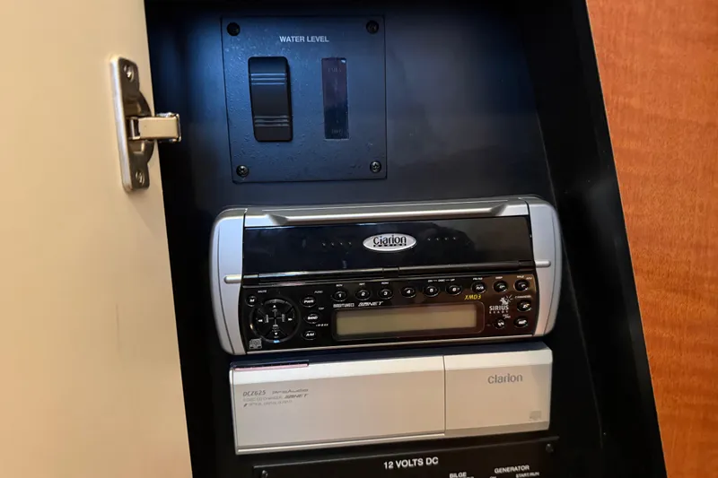 Slide: The Image of Control panel with Clarion stereo system in 2005 Sea Ray Sundancer 320 boat. - 47