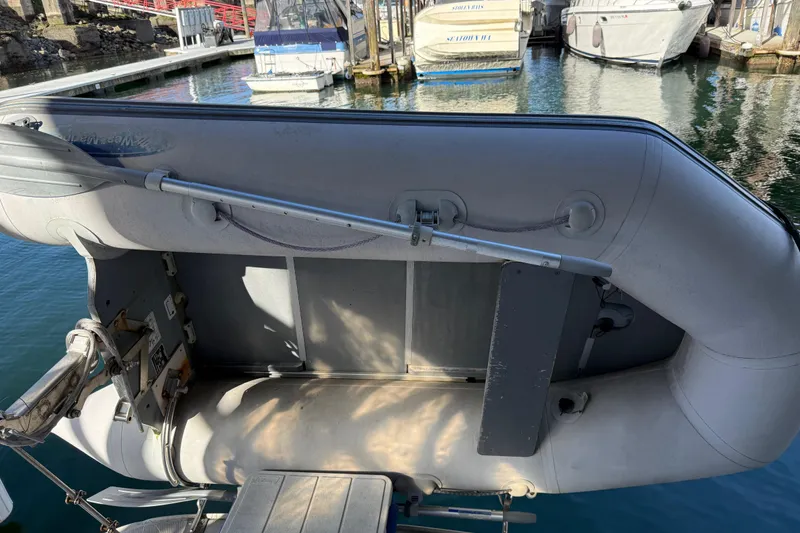 Slide: The Image of Inflatable boat docked near a 2005 Sea Ray Sundancer 320 yacht. - 48