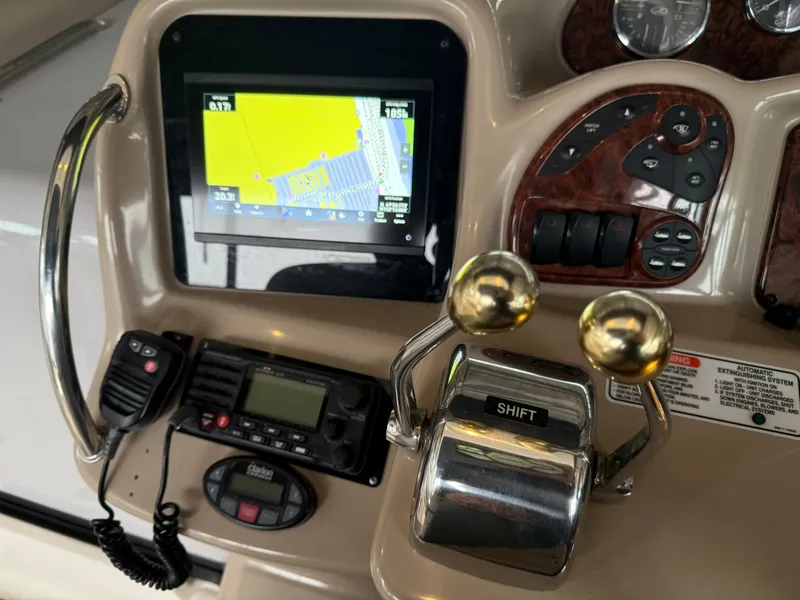 Slide: The Image of Control panel of a 2005 Sea Ray 320 Sundancer boat with navigation display. - 8