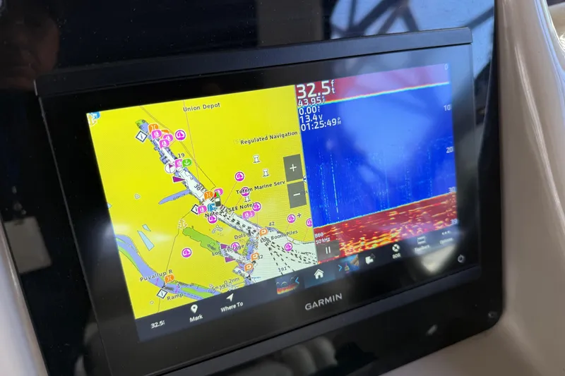 Slide: The Image of Garmin navigation display on 2005 Sea Ray Sundancer 320 boat, showing map and sonar data. - 9