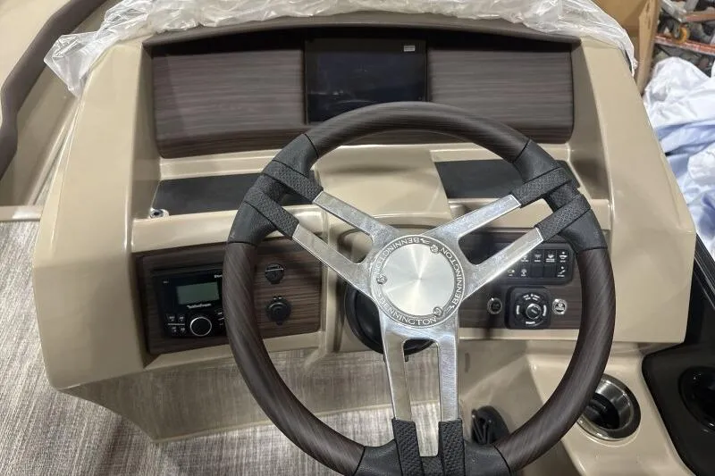 Slide: The Image of Steering wheel and dashboard of 2026 Bennington 25 LTSBSF boat. - 16