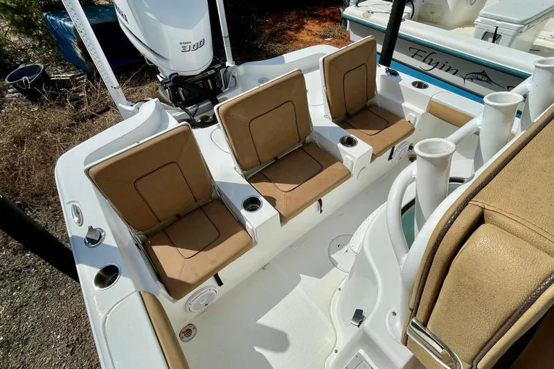 Slide: The Image of 2021 Sea Hunt BX 25 FS boat interior with tan seating and Yamaha 300 engine. - 24