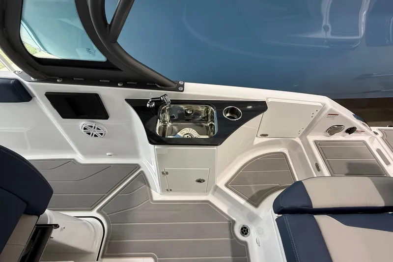 Slide: The Image of Interior view of 2026 Monterey Elite 25 OB boat featuring a sleek sink and seating area. - 9