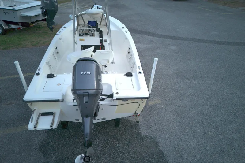 Slide: The Image of 2014 Key West 176 Bay Reef boat with Yamaha 115 engine, parked on asphalt. - 13