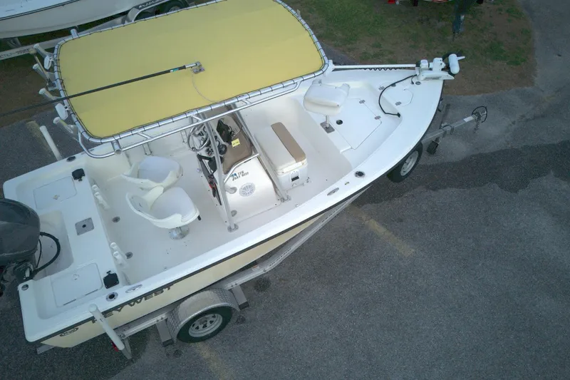 Slide: The Image of 2014 Key West 176 Bay Reef boat with yellow canopy on trailer, aerial view. - 4