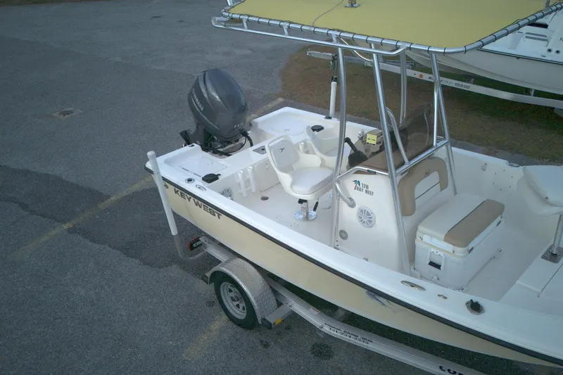 Slide: The Image of 2014 Key West 176 Bay Reef boat on trailer, featuring Yamaha outboard motor. - 7
