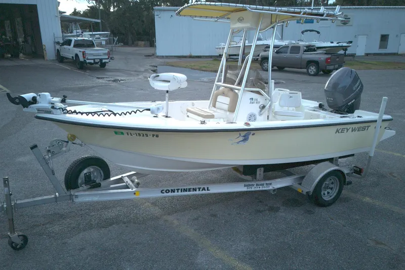 Slide: The Image of 2014 Key West 176 Bay Reef boat on trailer in parking lot. - 9