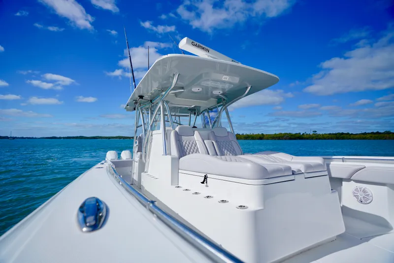 Slide: The Image of 2023 SeaHunter 41 CTS boat on calm blue water under clear sky. - 16