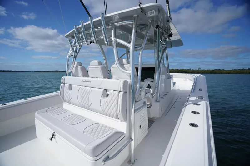 Slide: The Image of 2023 SeaHunter 41 CTS boat with sleek seating and modern design on open water. - 11